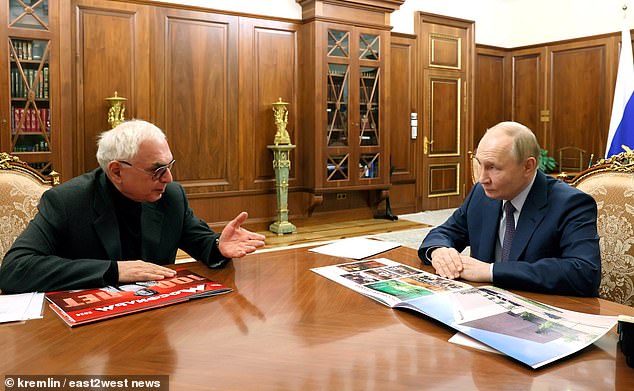 “We handed over to the (Russian) armed forces 28 T-55 tanks, eight PT-76 tanks, six BMPs and eight tractors that we had stored at the military-technical base,” Karen Shakhnazarov (left) told Vladimir. Putin (right)