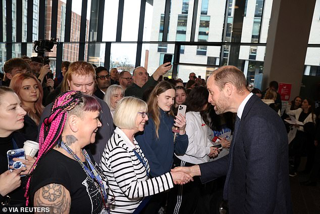 The Prince of Wales meets assembled staff and students during a visit to the University of Ulster's Belfast City Campus Centre.