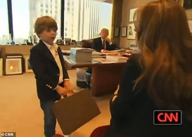 A lot has changed for the two since then, as Donald won the presidency twice and Barron now attends New York University's business school. In this screenshot, he is seen leaving Donald's office with a small suitcase in his hand.