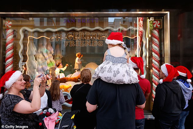 The opening of Myer's famous Christmas window display at its Melbourne CBD store will not take place (families are pictured at the iconic event in 2013)