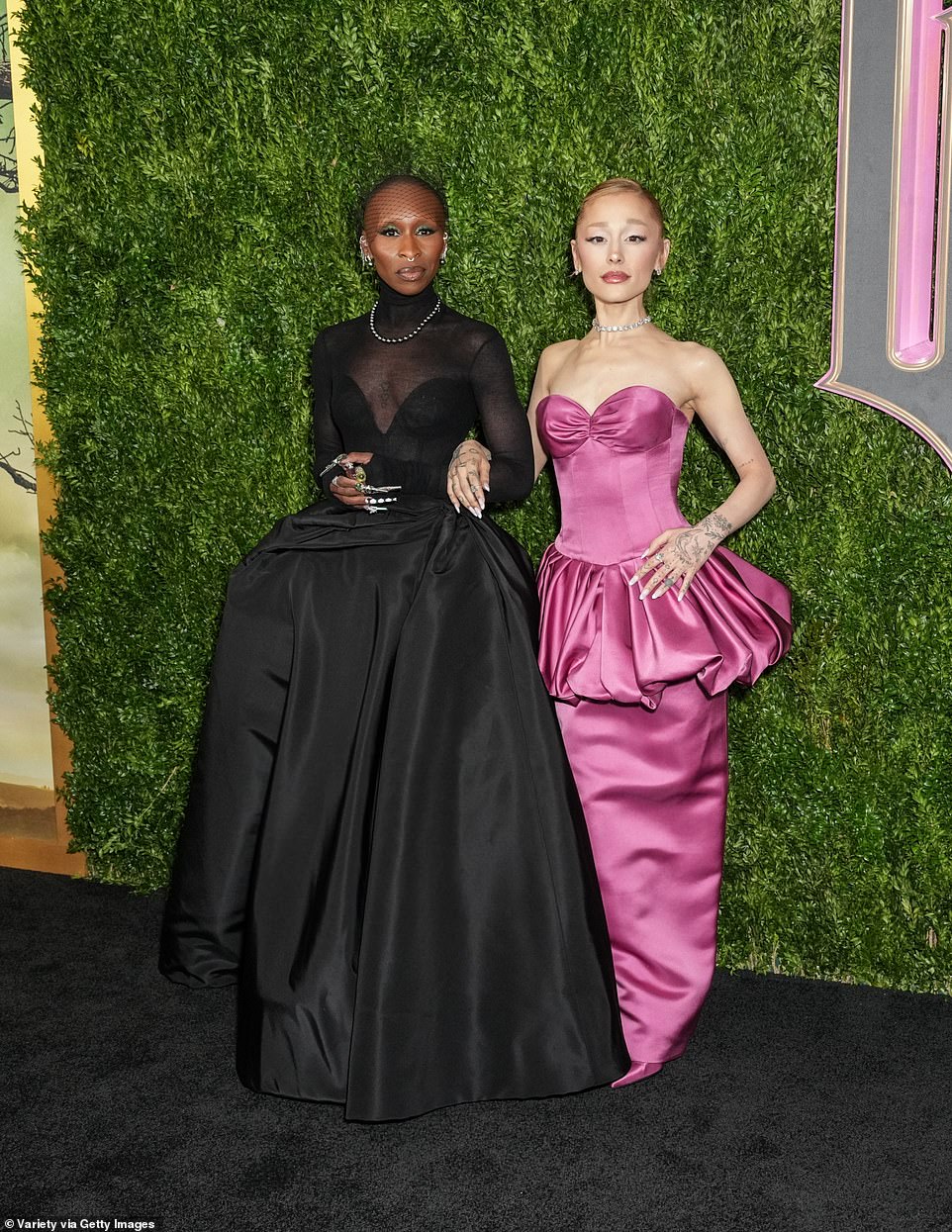 Grande and Erivo channeled their Wicked characters, Glinda and Elphaba, respectively, with their red carpet looks.