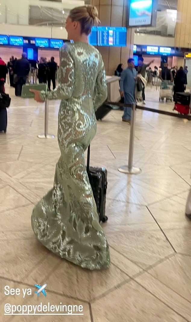 The model, 38, was spotted in a departure lounge in Saudi Arabia on Wednesday night still wearing an embellished dress.