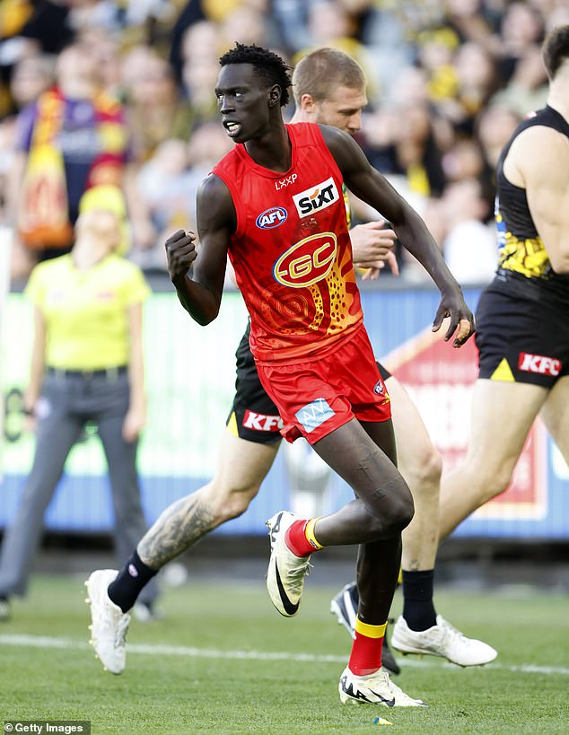 Gold Coast star Mac Andrew is pictured playing in the club's previous kit this season.