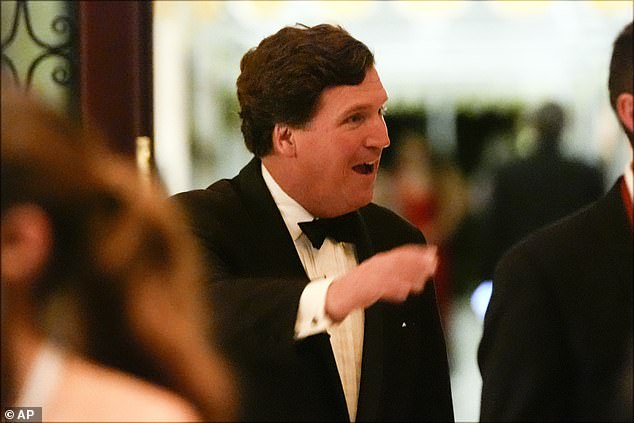 Tucker Carlson arrives before President-elect Donald Trump speaks during an America First Policy Institute gala at his Mar-a-Lago estate.