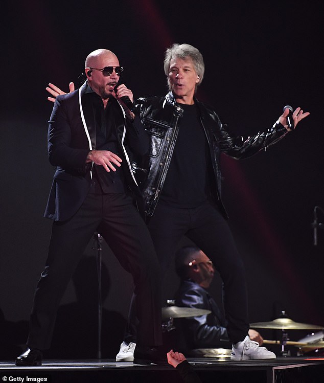 Bon Jovi performed on stage alongside Miami-raised musical artist Pitbull, 43, as they sang their new collaboration Now or Never.