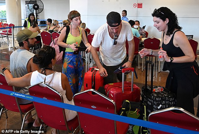 Major airlines including Qantas canceled multiple flights on Tuesday and Wednesday due to safety concerns causing travel chaos (pictured, travelers stranded in Bali).