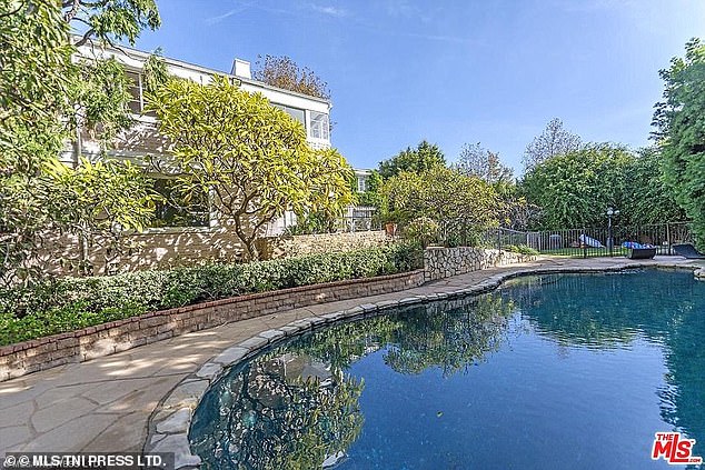 The comedian, 69, reportedly earns $8 million a year from The View and owns a real estate portfolio worth more than $15.7 million. Pictured is Goldberg's old home in Pacific Palisades valued at $8.8 million