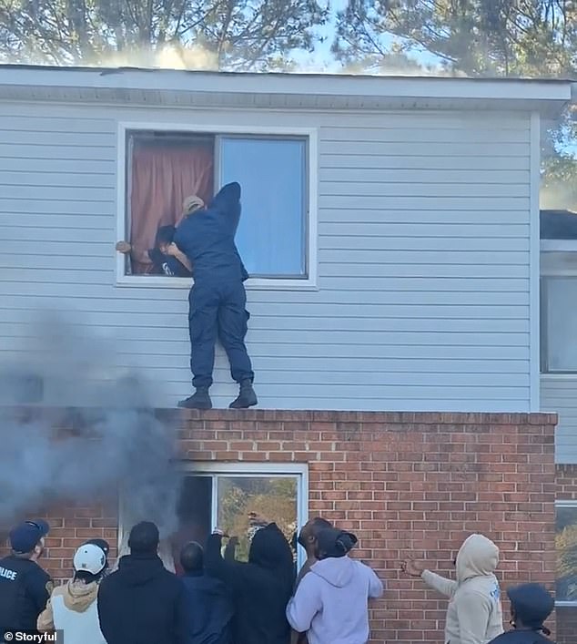 Below him, other good Samaritans raised their hands in an attempt to help catch people as they left the building.