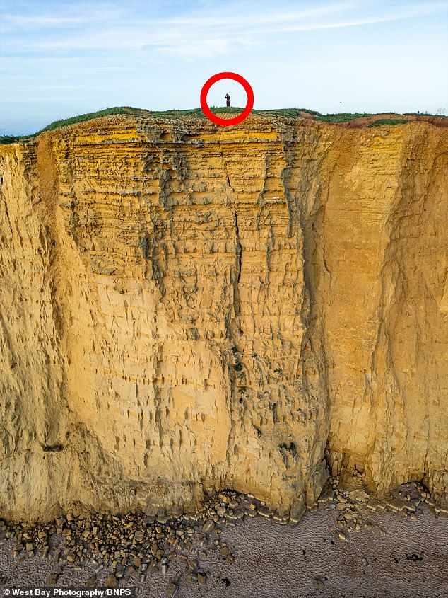 The crack, where the two unconscious women sat, suggests it could be the next part of the rock wall to collapse.