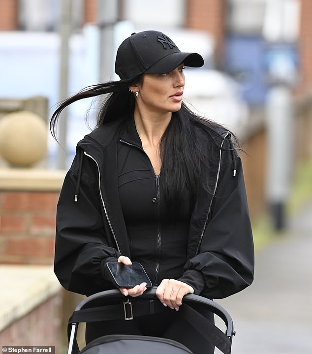 Annie Kilner was spotted without her wedding ring as she took her youngest son, Rezon, for a walk in Alderley Edge, Cheshire, on Friday.