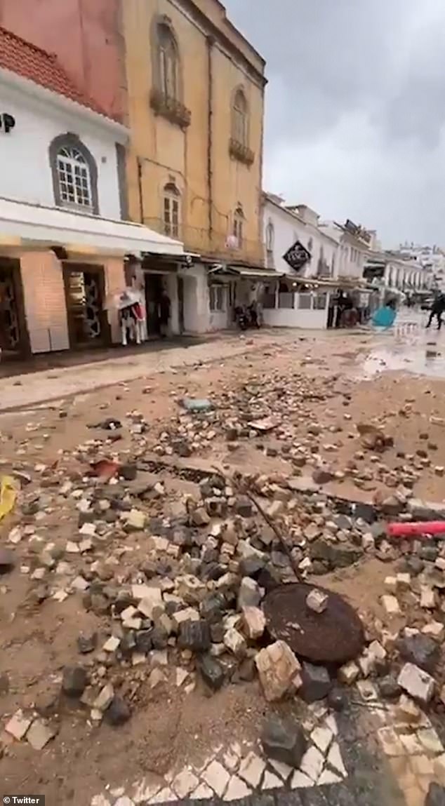 Separate videos show mud and debris strewn across the streets of the popular tourist destination after floodwaters subsided.