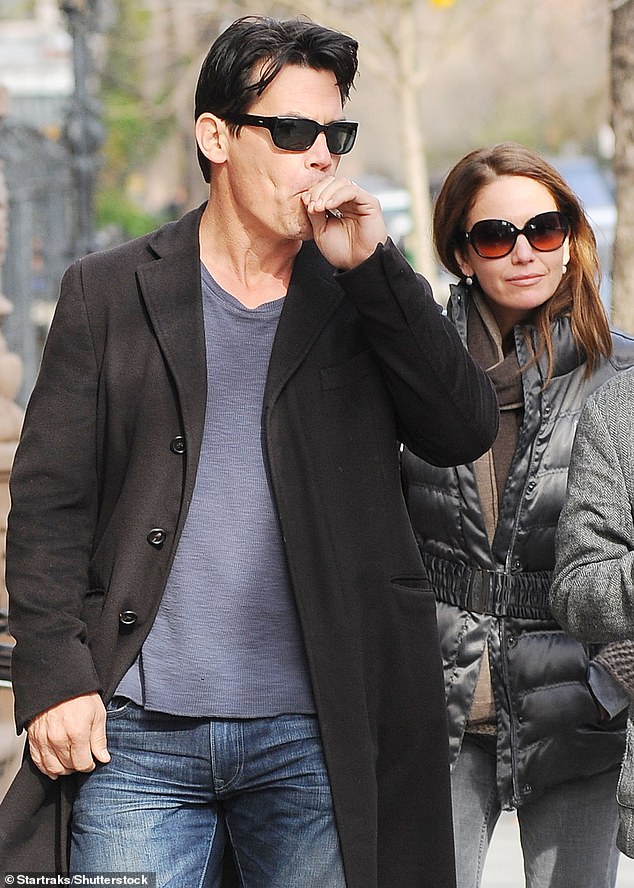 The star is seen smoking with his ex-wife Diane Lane in 2011.