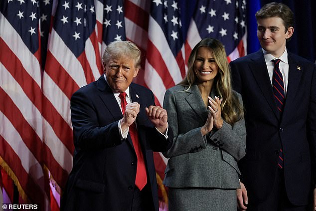 Here Barron is seen towering over his mother Melanie and father Donald as his father celebrates winning the election.