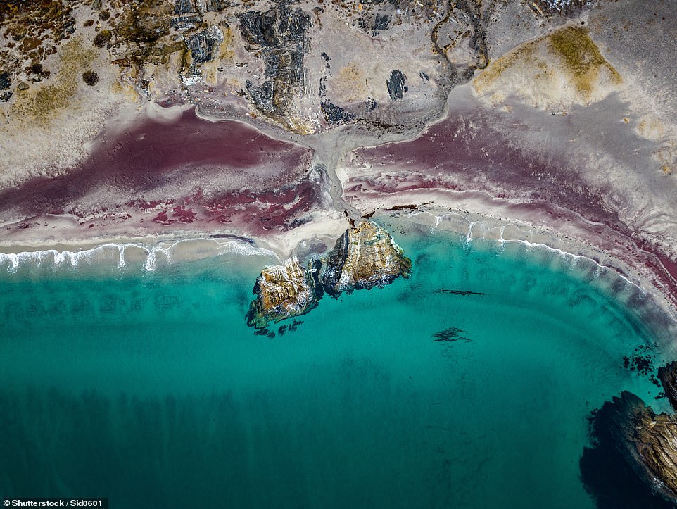 Mjelle Beach in northern Norway is famous for its red sand, caused by minerals, specifically garnet particles, from the rocks on the beach. Visit Bodø says: 