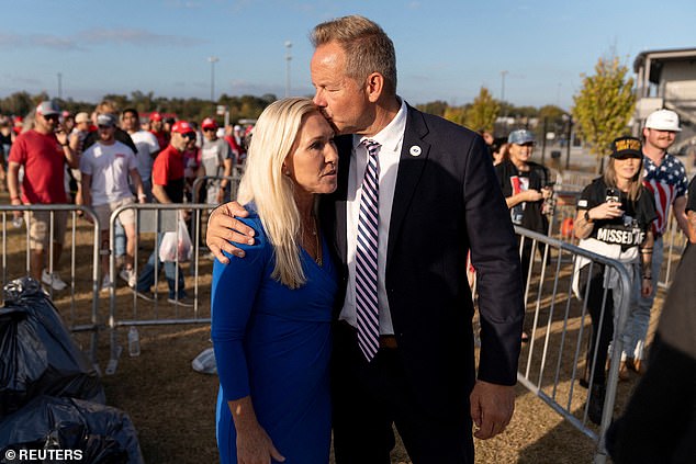 Rep. Marjorie Taylor Greene (R-GA) is kissed by her boyfriend Brian Glenn, program director of Right Side Broadcasting Network (RSBN)