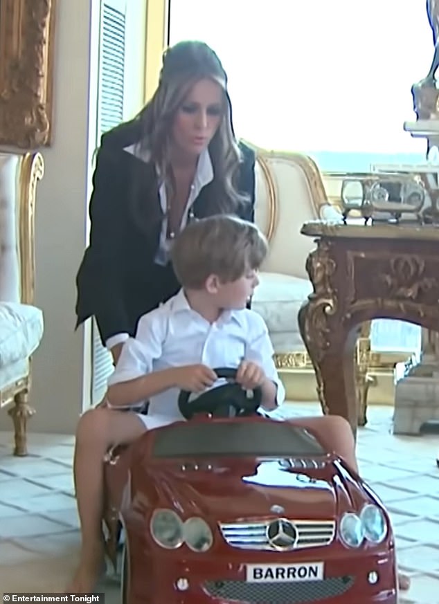 Elegantly dressed Melania takes the opportunity to take her son for a ride in her small red vehicle