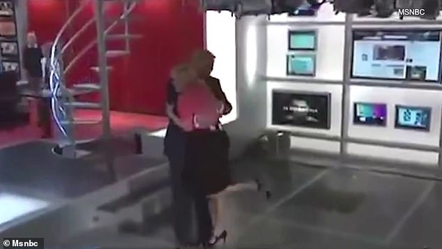 Brzezinski and Trump are seen embracing as he enters the Morning Joe set, with Brzezinski lifting her leg romantically as she leans in for the hug