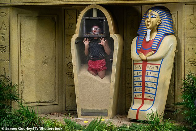 As he headed to the testing area, Dean said, 'I'm going crazy!' as Ant and Dec presented him with a mummy figure in which he was encased until he shouted I'm a celebrity... Get me out of here!