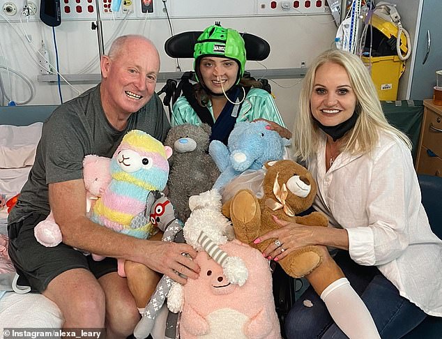 Leary (pictured with parents Russ and Belinda) had to learn to walk again after a horrific bicycle accident in 2021 came incredibly close to claiming his life.