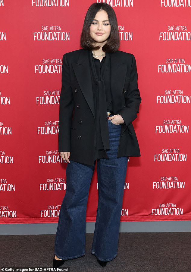 She paired the look with high-waisted jeans and a pair of simple black heels, wearing her dark hair down for her last night on the town.