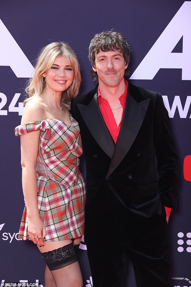 Tim, 43, and Lizzie, 28, couldn't keep their hands off each other as they walked the red carpet and officially confirmed their relationship to Daily Mail Australia.