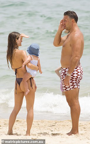 Little Robbie looked cute as a button in a blue plush hat and a cute sky blue swimsuit.