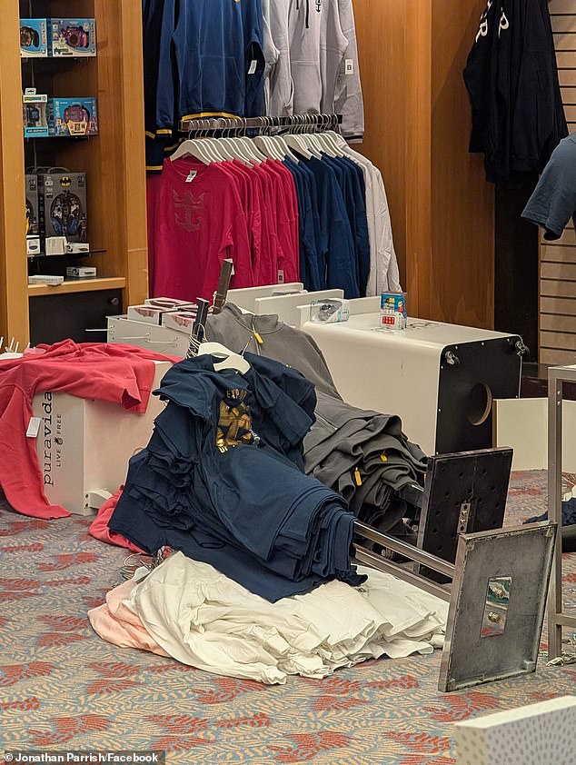 A clothing display fell on its side after the freak storm that saw the ship's list