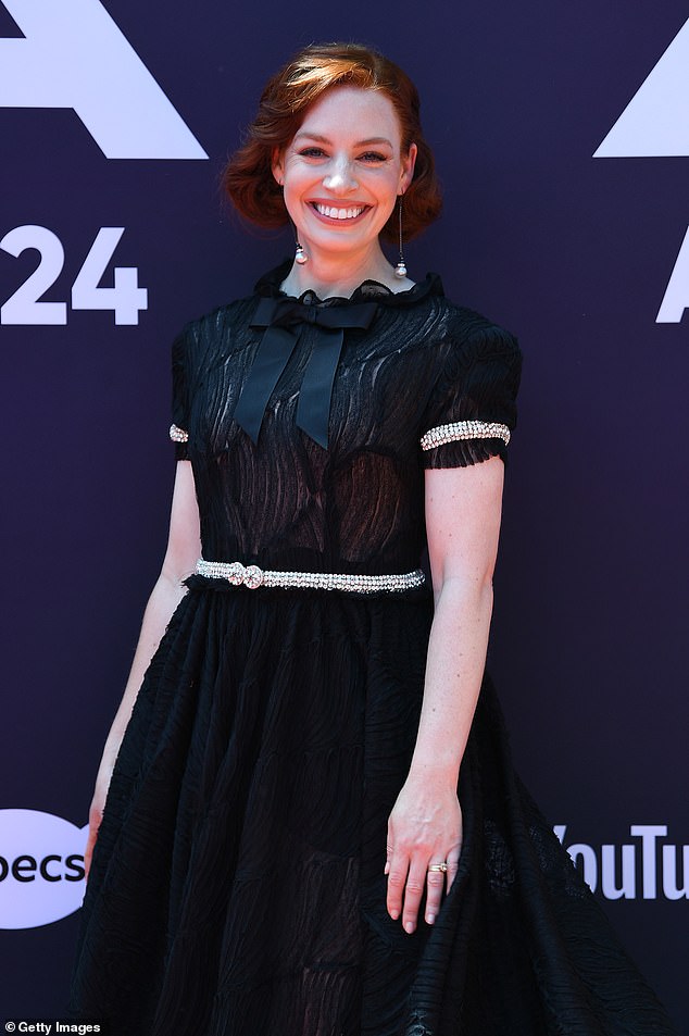 Finishing off the elegant dress was a black bow tie and gold decorative details on the waist and sleeves.