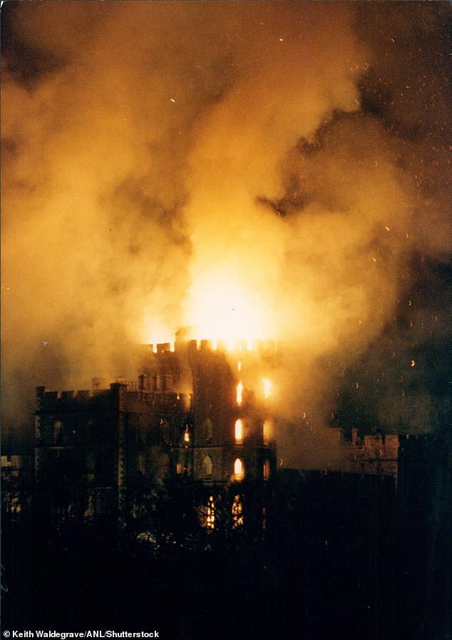 Flames can be seen roaring from the castle windows.