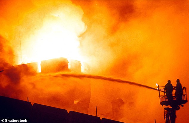 Firefighters work to extinguish the flames at Windsor Castle.