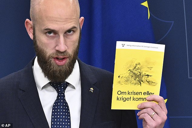 Swedish Civil Defense Minister Carl-Oskar Bohlin presents the new version of the brochure 