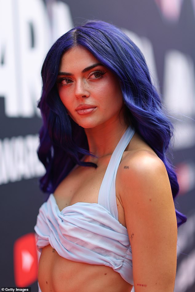 The singer also turned heads with her indigo hair color at the event.