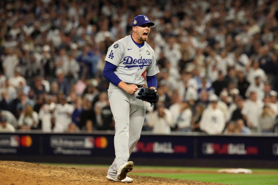 Dodgers pitcher Blake Treinen reacts by recording the final out in the eighth inning of Game 5 of the World Series