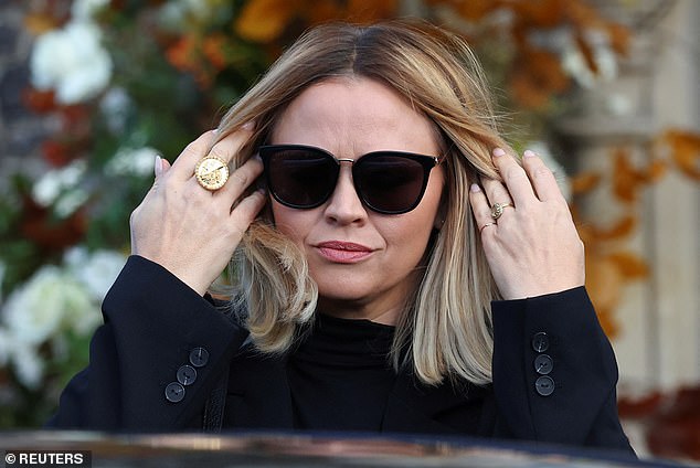 Kimberley shielded her eyes with sunglasses as she headed to church.