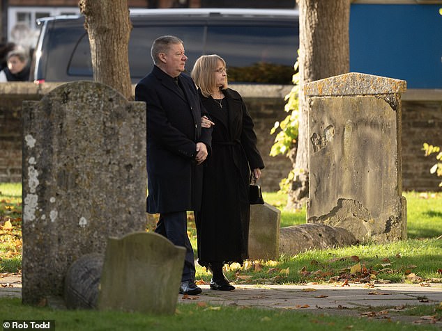 Liam Payne's father Geoff and mother Karen arrive at their son's funeral today.