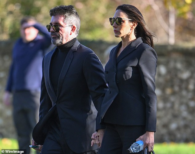 Simon Cowell arrives at church today accompanied by his partner Lauren Silverman