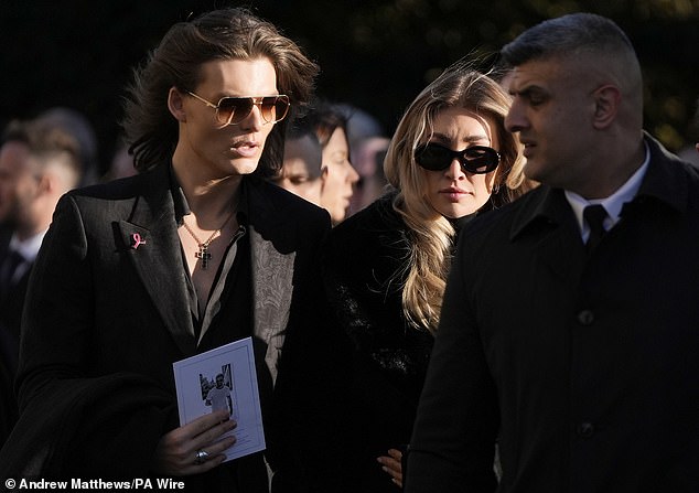 Payne's girlfriend, Kate Cassidy, was comforted by her friend Damian Hurley at today's service.