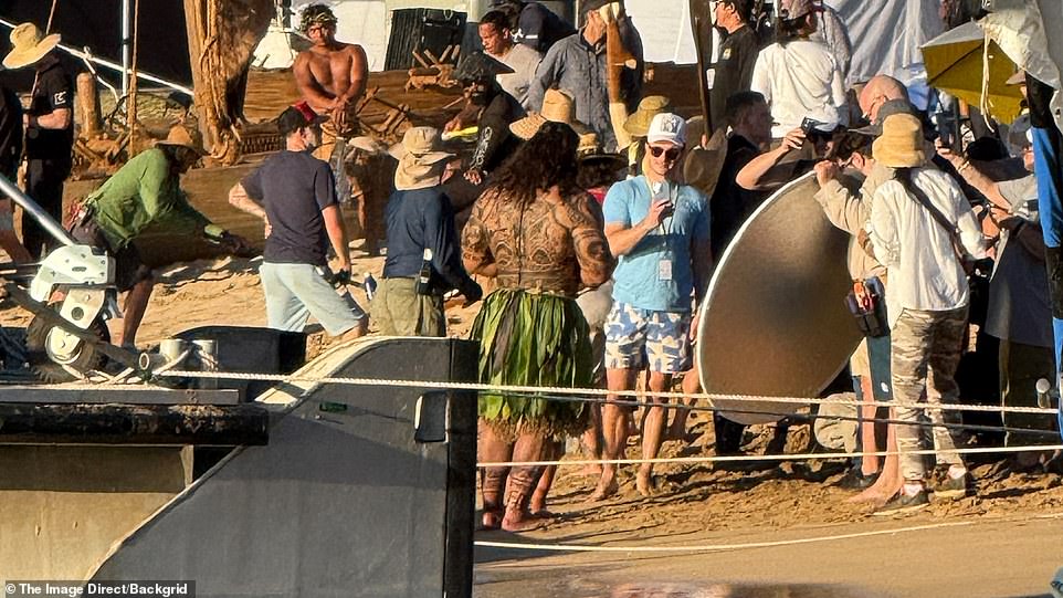 The Rock was the center of attention as he filmed on the beach in Hawaii