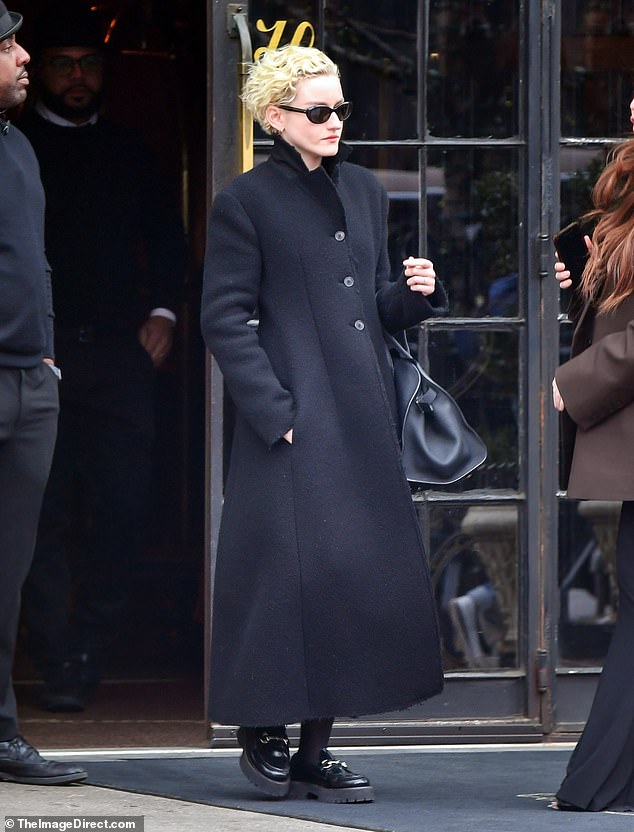 The Gucci brand ambassador, 30, looked chic in an all-black outfit: sunglasses, long winter coat, handbag and a $1,220 Gucci 'Horsebit Women's Loafer'.