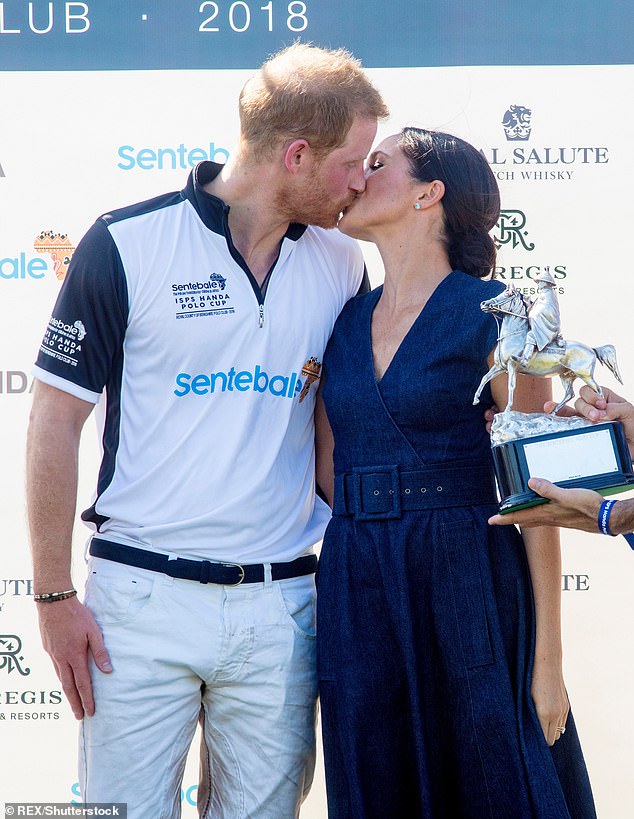 Harry and Meghan kiss after the prince won a charity match in 2018