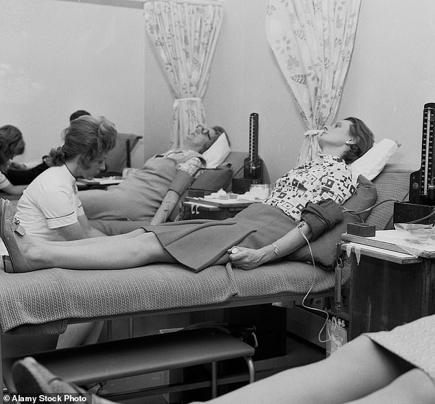 Blood donors cared for by a nurse at a health center in Lewisham, south London, in the late 1960s and early 1970s.