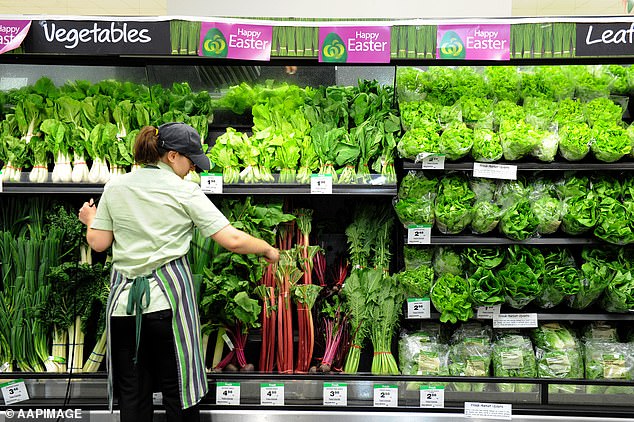 More than 1,500 warehouse workers at four distribution centers will leave their jobs on Thursday over demands for better pay (pictured, a Woolworths employee in Brisbane)