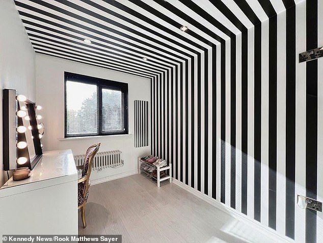 One of the bedrooms in the property, which also has a funky decor with black and white stripes