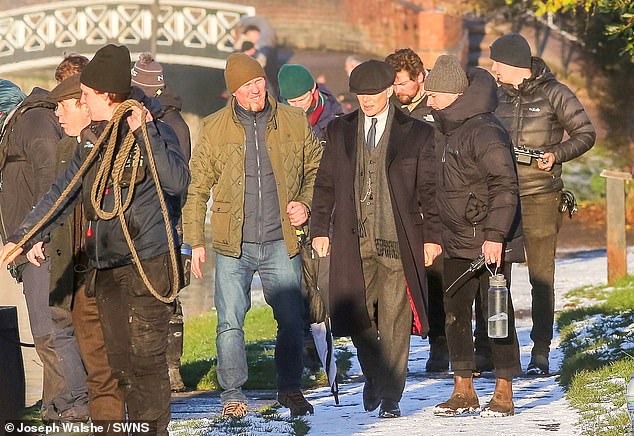 The cast and crew appeared unaffected by the frigid temperatures as they filmed a scene on the canal with Murphy, who reprises his role as criminal kingpin Tommy Shelby.