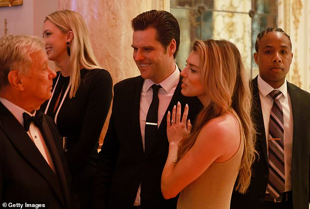 Matt Gaetz (C) and wife Ginger Luckey Gaetz talk with another guest at the America First Policy Institute Gala held at Mar-a-Lago on November 14, 2024 in Palm Beach