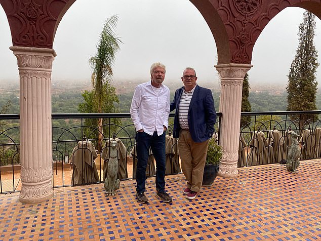 Neil pictured above with Sir Richard, who is said to treat the hotel as his 