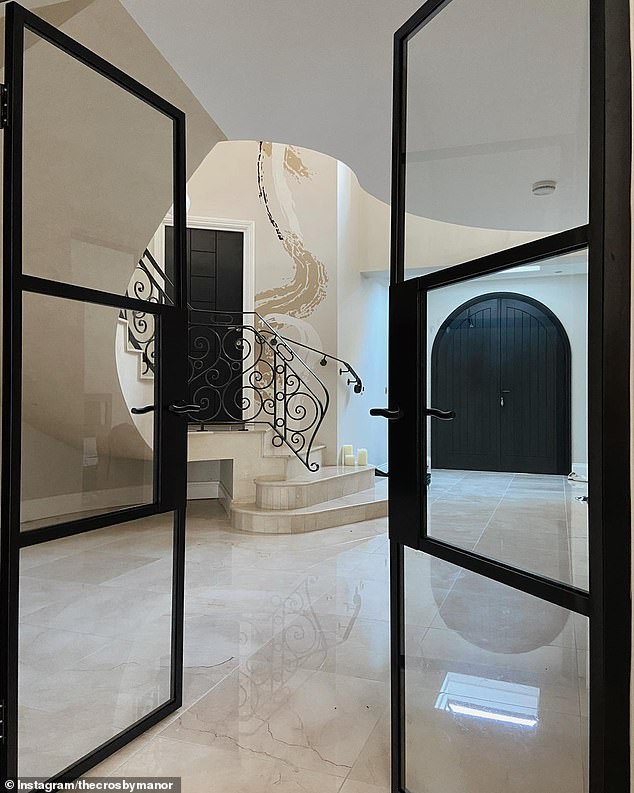 In a YouTube video at the time, the reality star showed off her beautiful home renovation, which featured dark wood double doors and a marble-floored foyer.