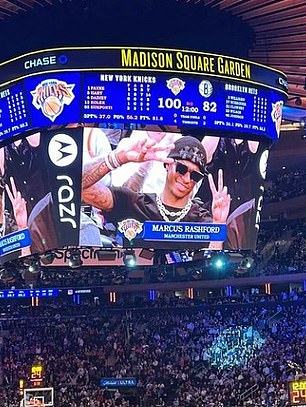 The United star's face appeared on the big screen as he enjoyed the night in New York