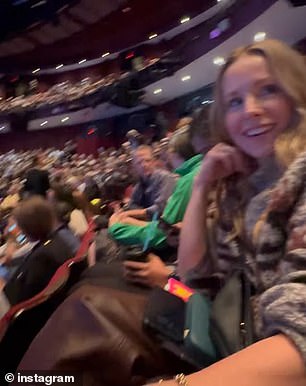 Before the show started, Dax noticed that two women sitting in front of the couple were trying to look up who Kristen was on their cell phone after they saw several fans 