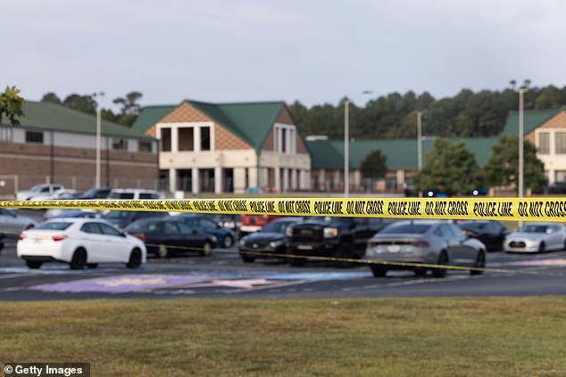 That fateful morning, the teen allegedly hid the long-barreled gun inside a piece of cardboard carefully stored in his backpack while aboard a school bus, an agent with the Georgia Bureau of Investigation said. Pictured: Police tape surrounds the perimeter of Apalachee High School on September 5, 2024 in Winder, Georgia.